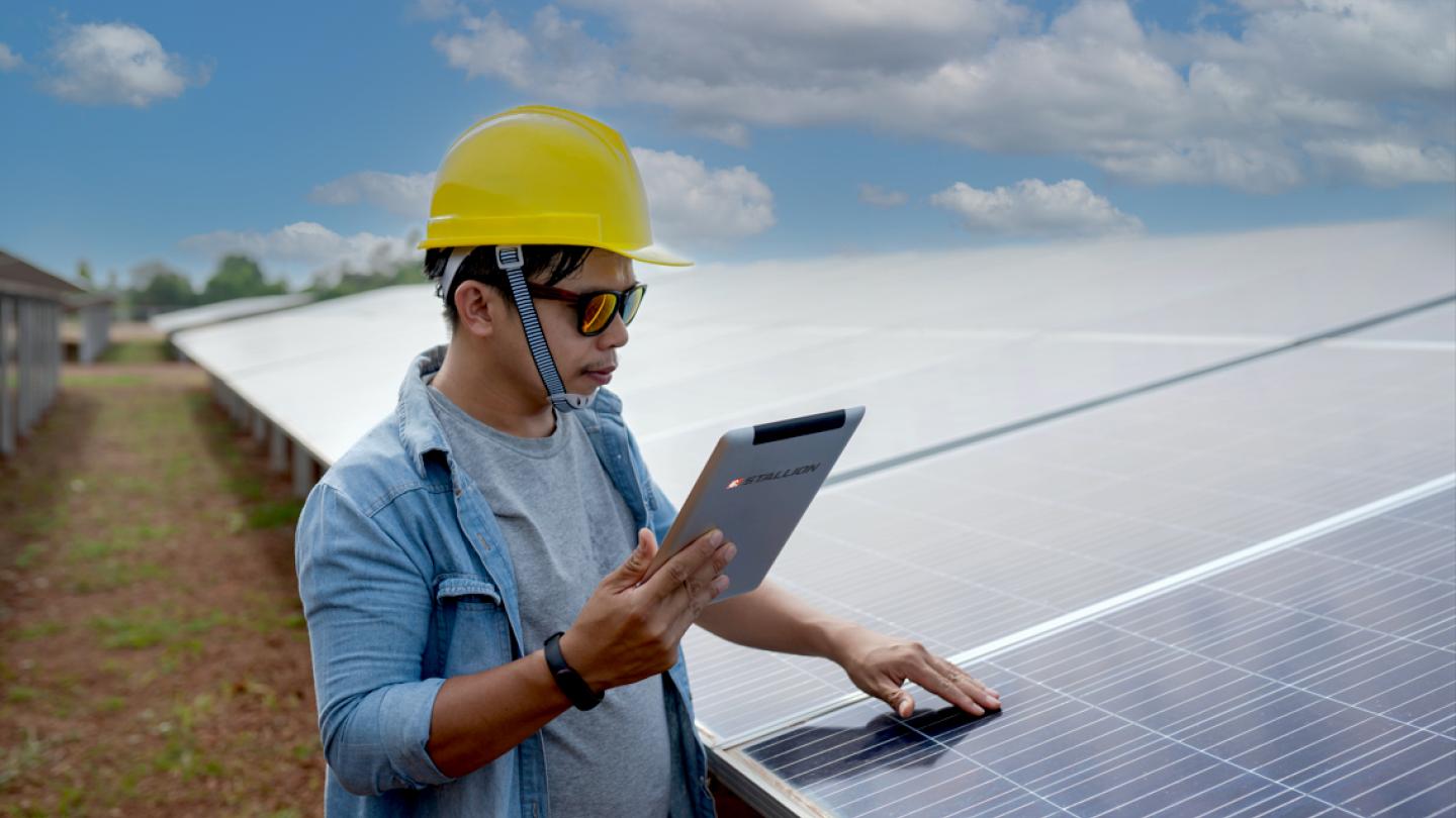 Man working on solar panels