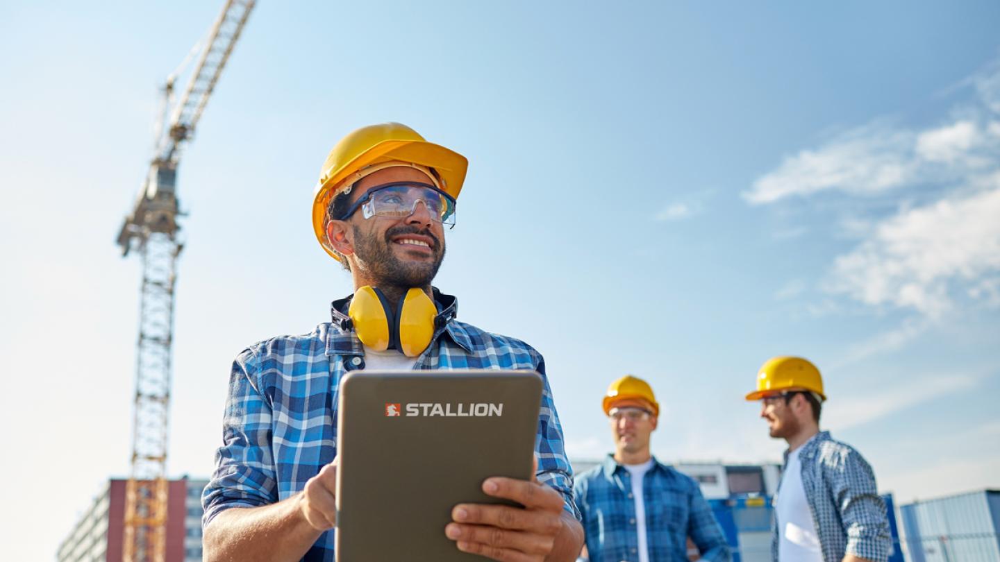 Men on construction site with crane