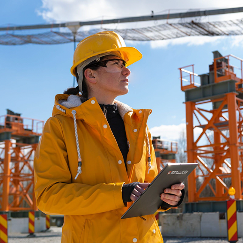 Woman wearing safety equipment at construction site